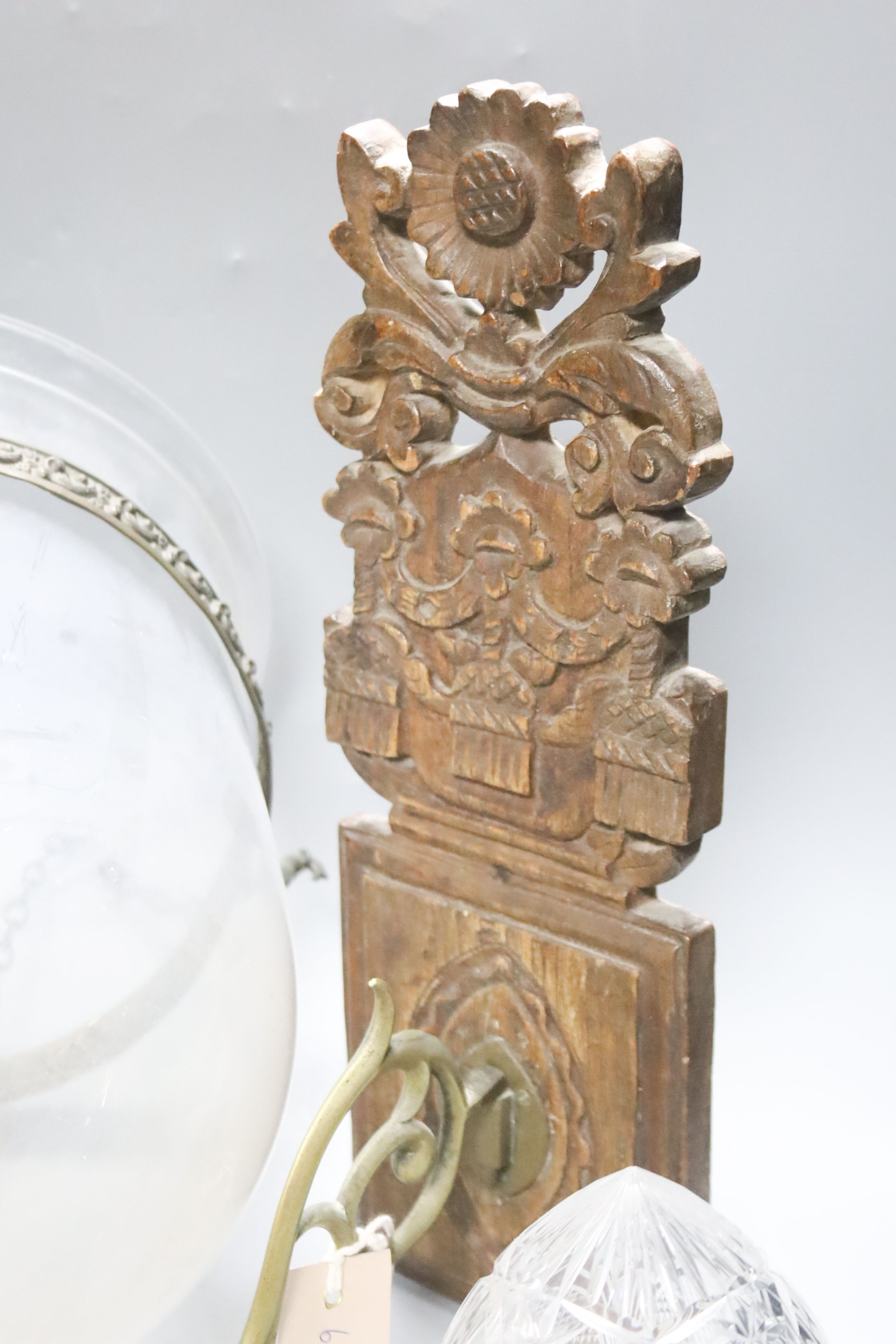 A Dutch carved wood and brass wall candle holder and a hanging glass lantern with cover